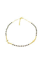 Halskette mit schwarzen Kristallkugeln goldfarben